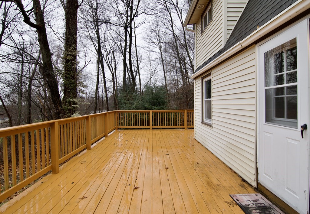 338 Wilbraham Road Hampden, MA 01036 - Photo 5 of 42 a view of balcony with wooden floor and fence