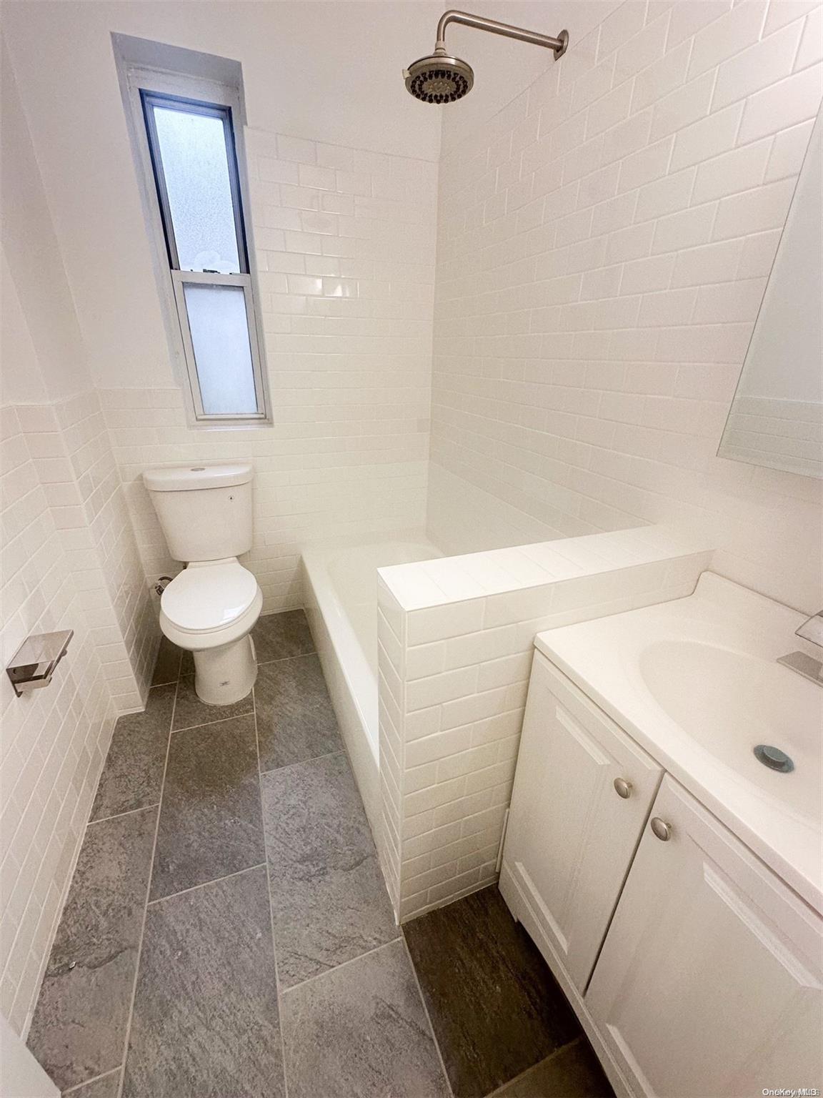 110-34 73rd Road, Unit 4C Queens, NY 11375 - Photo 9 of 10 a bathroom with a sink and a toilet