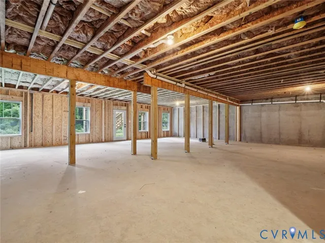 a view of an empty room with a garage