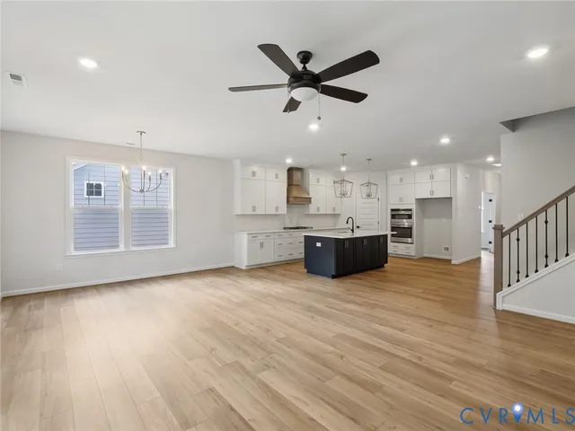 a view of a kitchen with a sink and a window