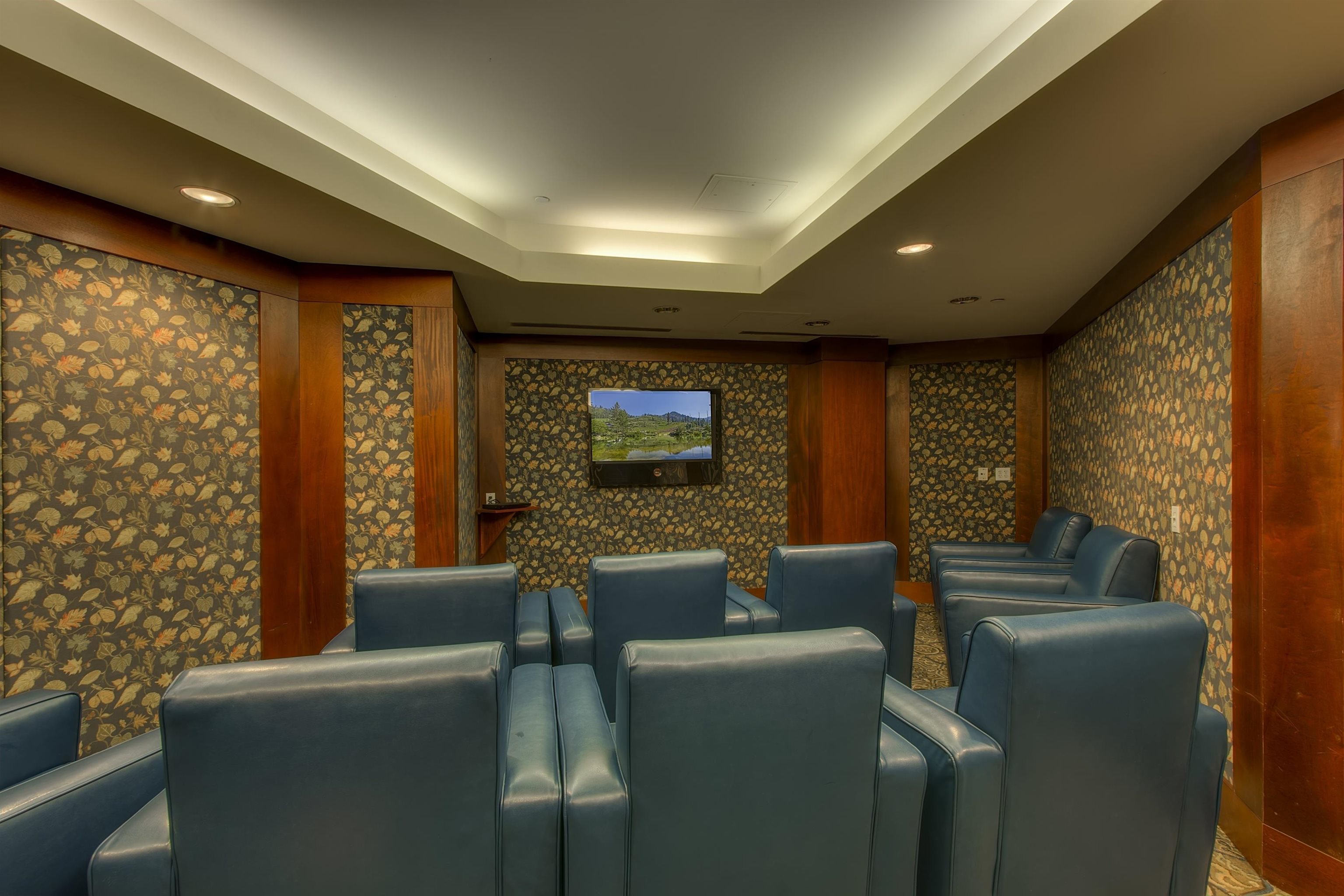 1750 Village East Road, Unit 409 (5409) Olympic Valley, CA 96146 - Photo 25 of 27 a media room with lots of chairs and a projector screen