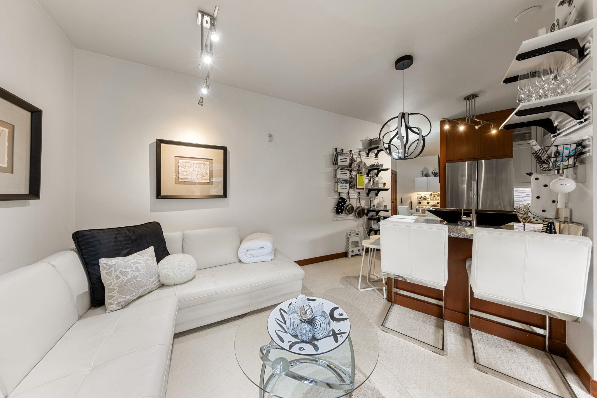 1750 Village East Road, Unit 409 (5409) Olympic Valley, CA 96146 - Photo 6 of 27 a living room with furniture and wooden floor
