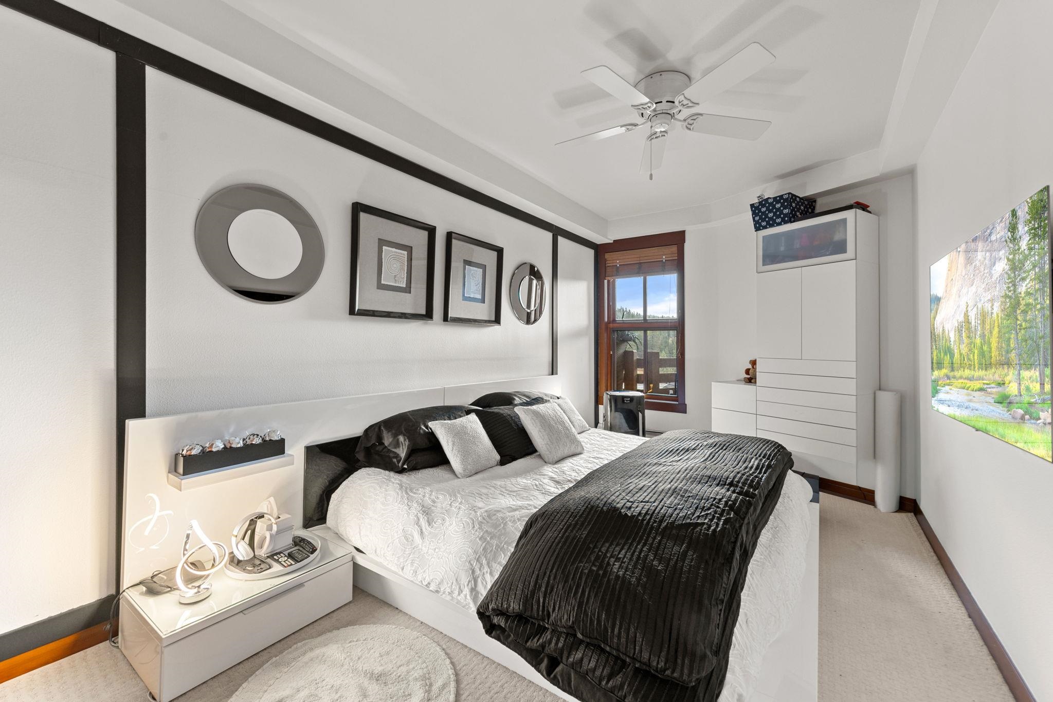 1750 Village East Road, Unit 409 (5409) Olympic Valley, CA 96146 - Photo 10 of 27 a bedroom with a bed and a chandelier