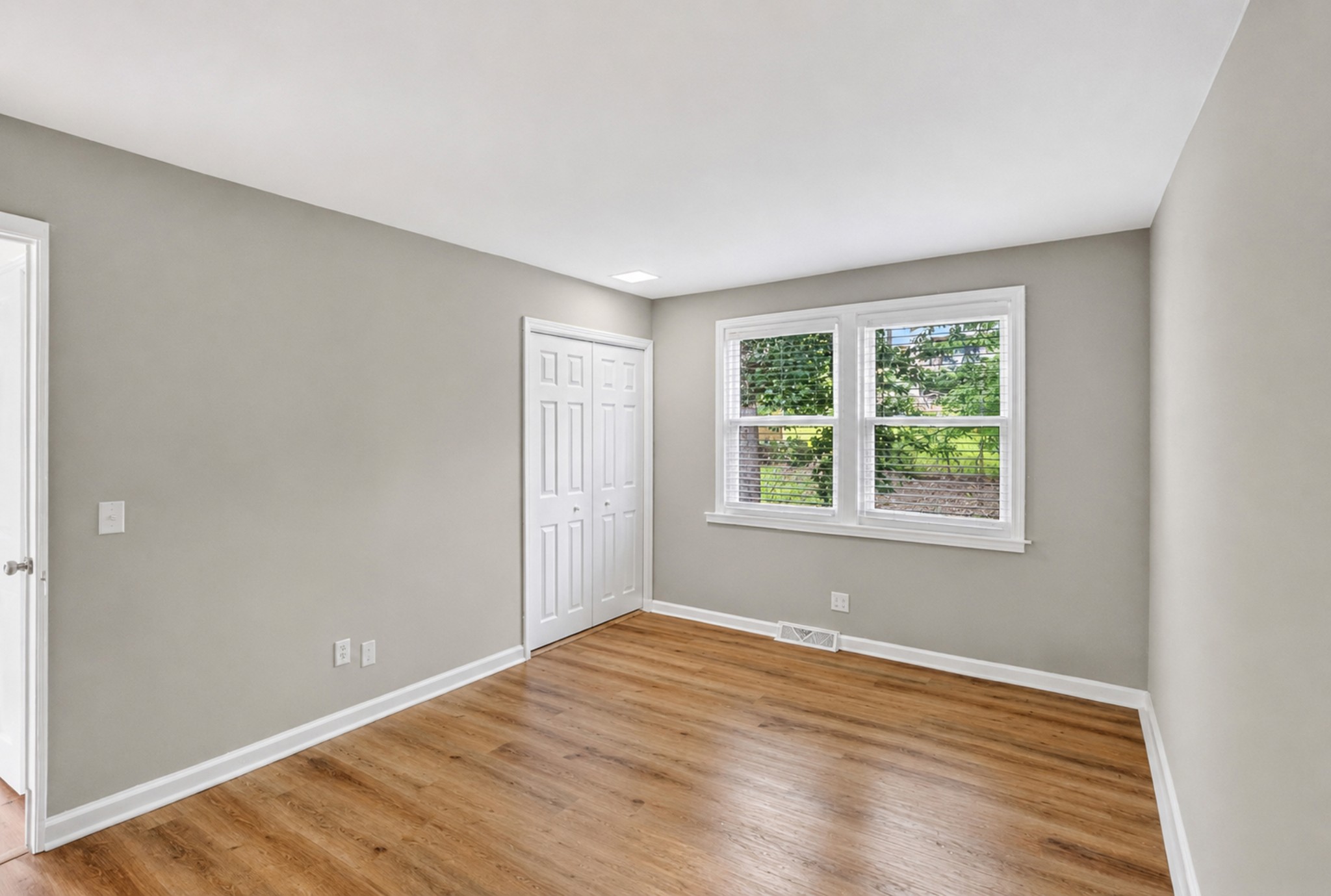 489 Canton Pass Madison, TN 37115 - Photo 20 of 25 an empty room with wooden floor and windows
