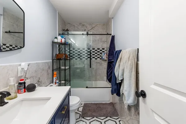 a bathroom with a sink and mirror