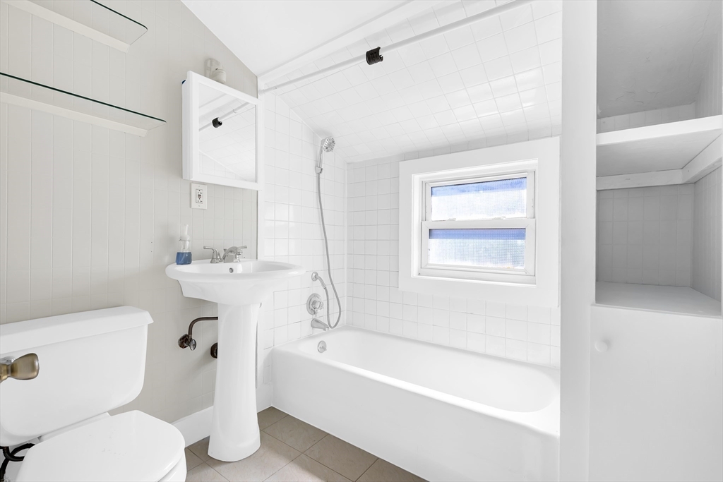 28 Evergreen Street, Unit 3 Boston, MA 02130 - Photo 2 of 16 a white toilet sitting next to a bath tub