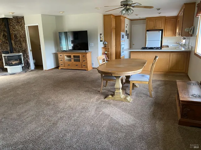 a view of a backyard with sitting area and furniture