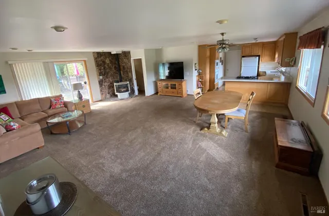 a backyard of a house with table and chairs