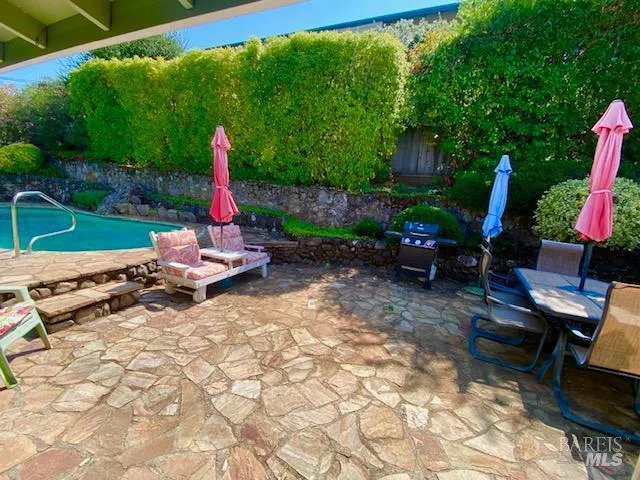 a spacious bedroom with a bed and a large window