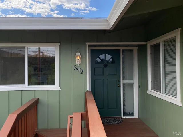 a view of a door and a window