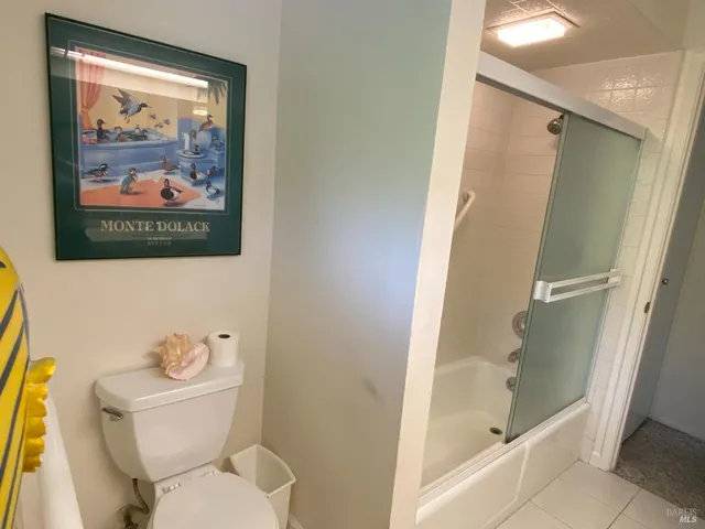 a view of a house with wooden deck