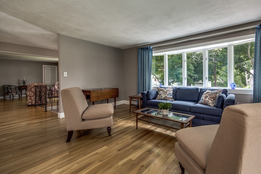 21 Putnam Road Bedford, MA 01730 - Photo 2 of 21 a living room with furniture and a large window