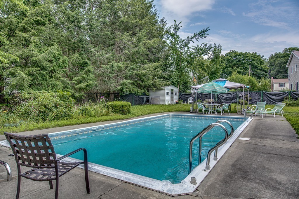 21 Putnam Road Bedford, MA 01730 - Photo 21 of 21 a view of a swimming pool with a patio