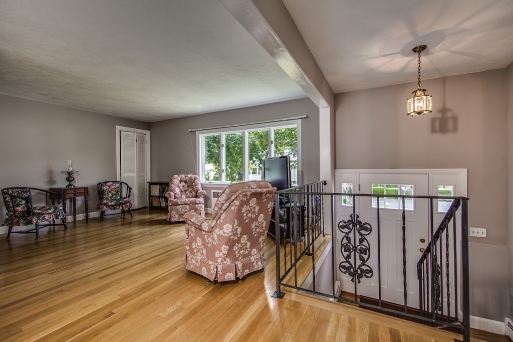 21 Putnam Road Bedford, MA 01730 - Photo 6 of 21 a living room with furniture and wooden floor