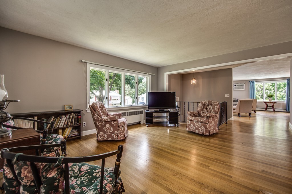 21 Putnam Road Bedford, MA 01730 - Photo 7 of 21 a living room with furniture and a flat screen tv