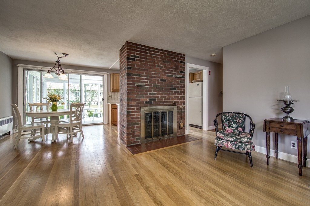 21 Putnam Road Bedford, MA 01730 - Photo 8 of 21 a living room with furniture and a fireplace