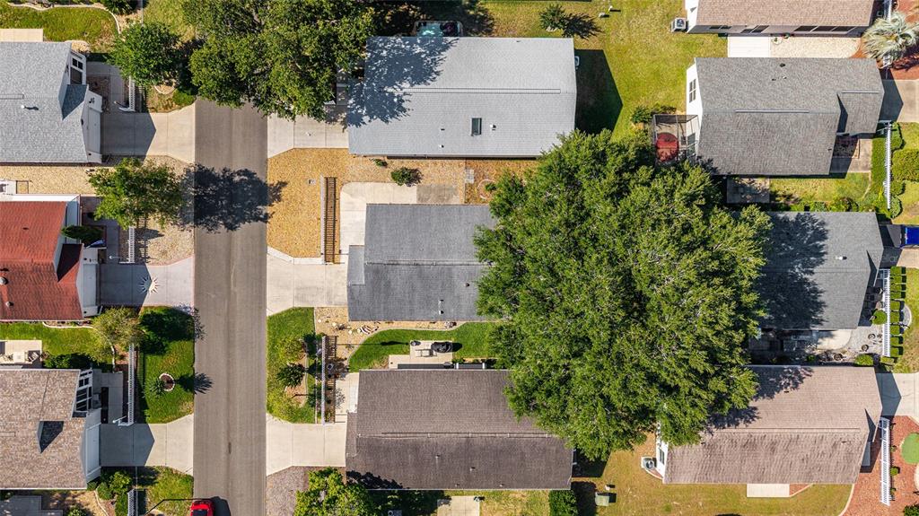 1710 Rosales Road The Villages, FL 32162 - Photo 23 of 23 an aerial view of a house with yard and lake view