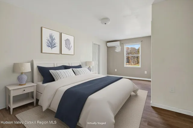 a bedroom with bed and a window