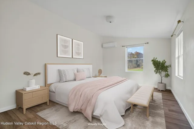 a bedroom with a large bed and a couch