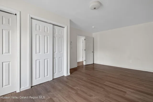 a view of a livingroom with wooden floor