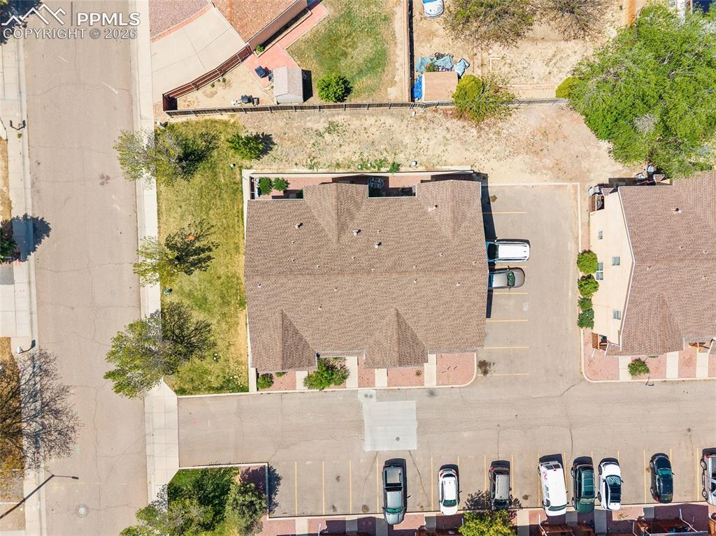 4400 Rawhide Road, Unit 157 Pueblo, CO 81008 - Photo 7 of 36 a aerial view of a house with a yard and plants
