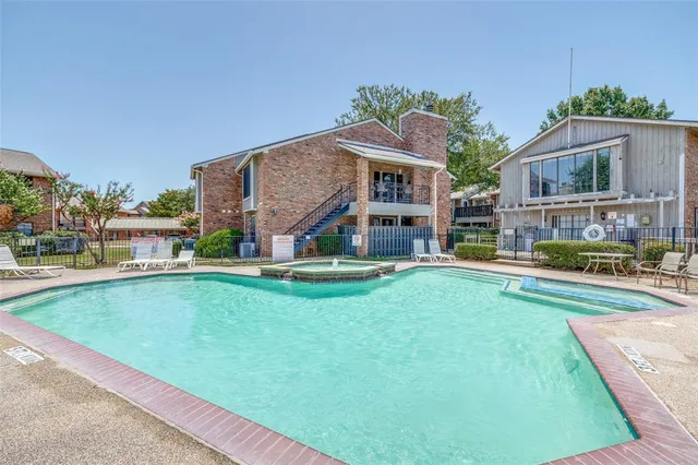 a aerial view of a house with swimming pool and deck