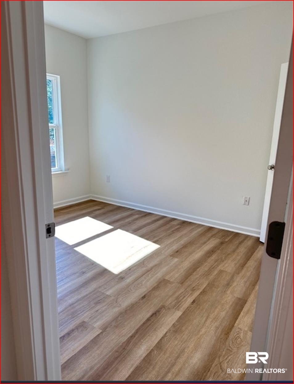 13906 Antler Hl Road Daphne, AL 36527 - Photo 10 of 23 Empty room with light hardwood / wood-style floors