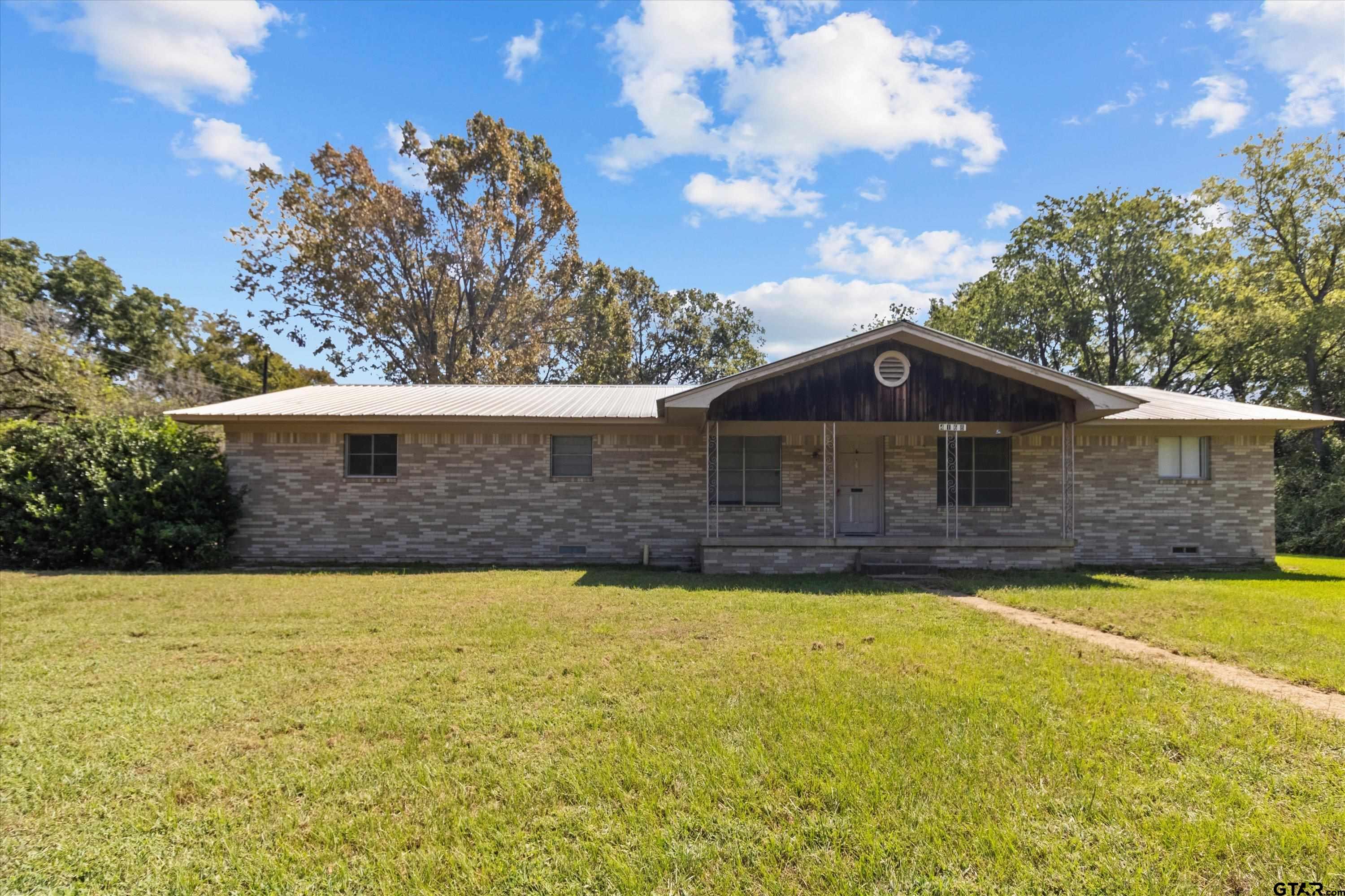4168 Gallion Avenue Tyler, TX 75708 - Photo 1 of 27 a front view of a house with a yard