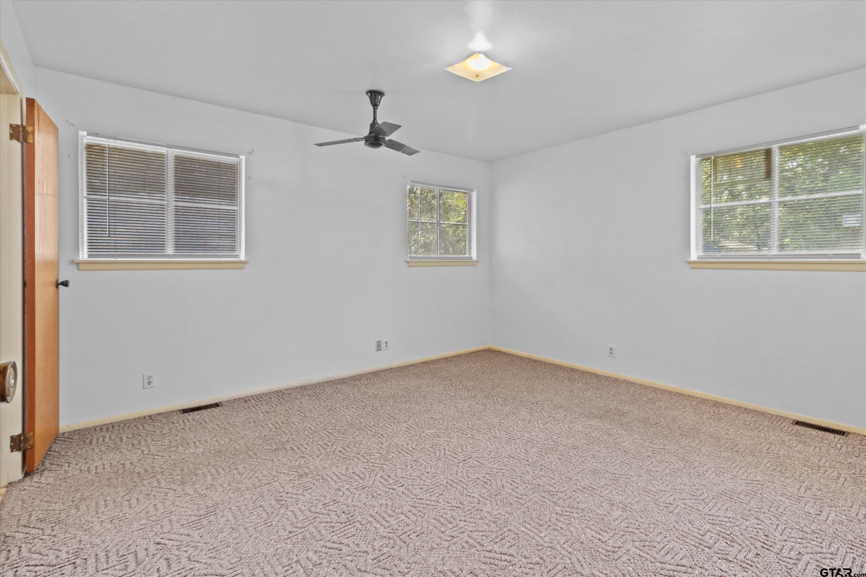 4168 Gallion Avenue Tyler, TX 75708 - Photo 11 of 27 an empty room with windows