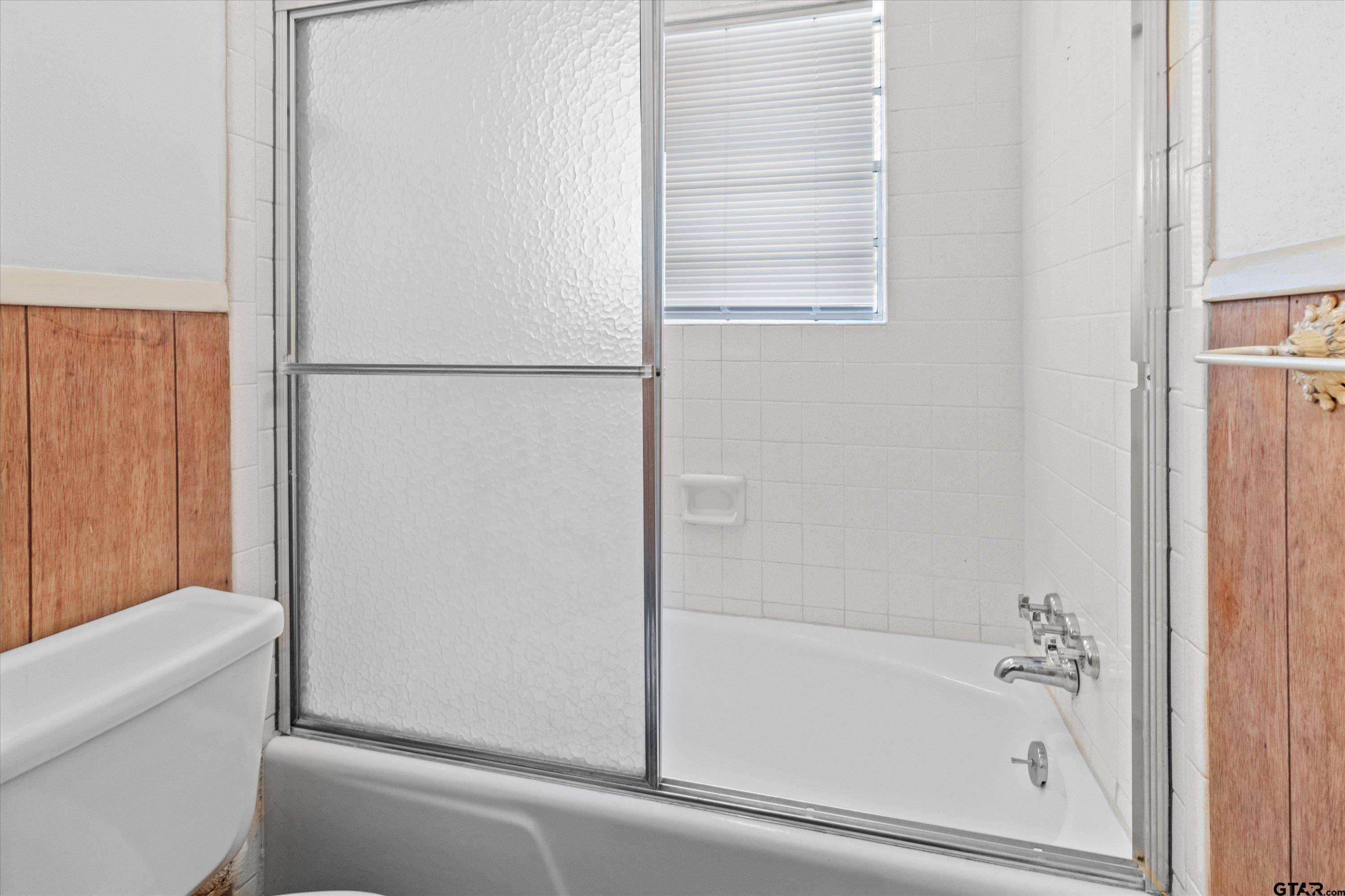 4168 Gallion Avenue Tyler, TX 75708 - Photo 15 of 27 a bathroom with a bathtub