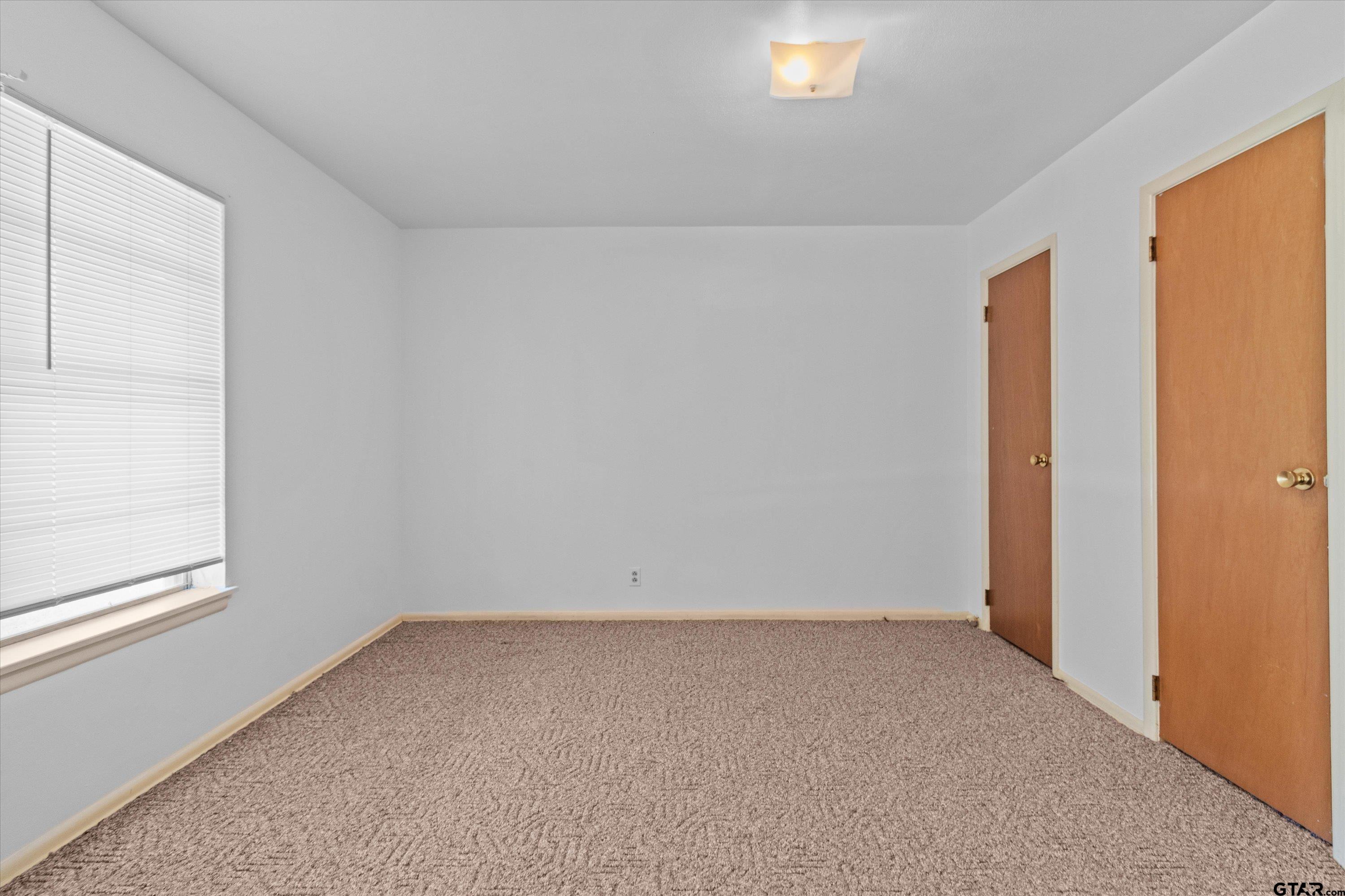 4168 Gallion Avenue Tyler, TX 75708 - Photo 18 of 27 an empty room with a window