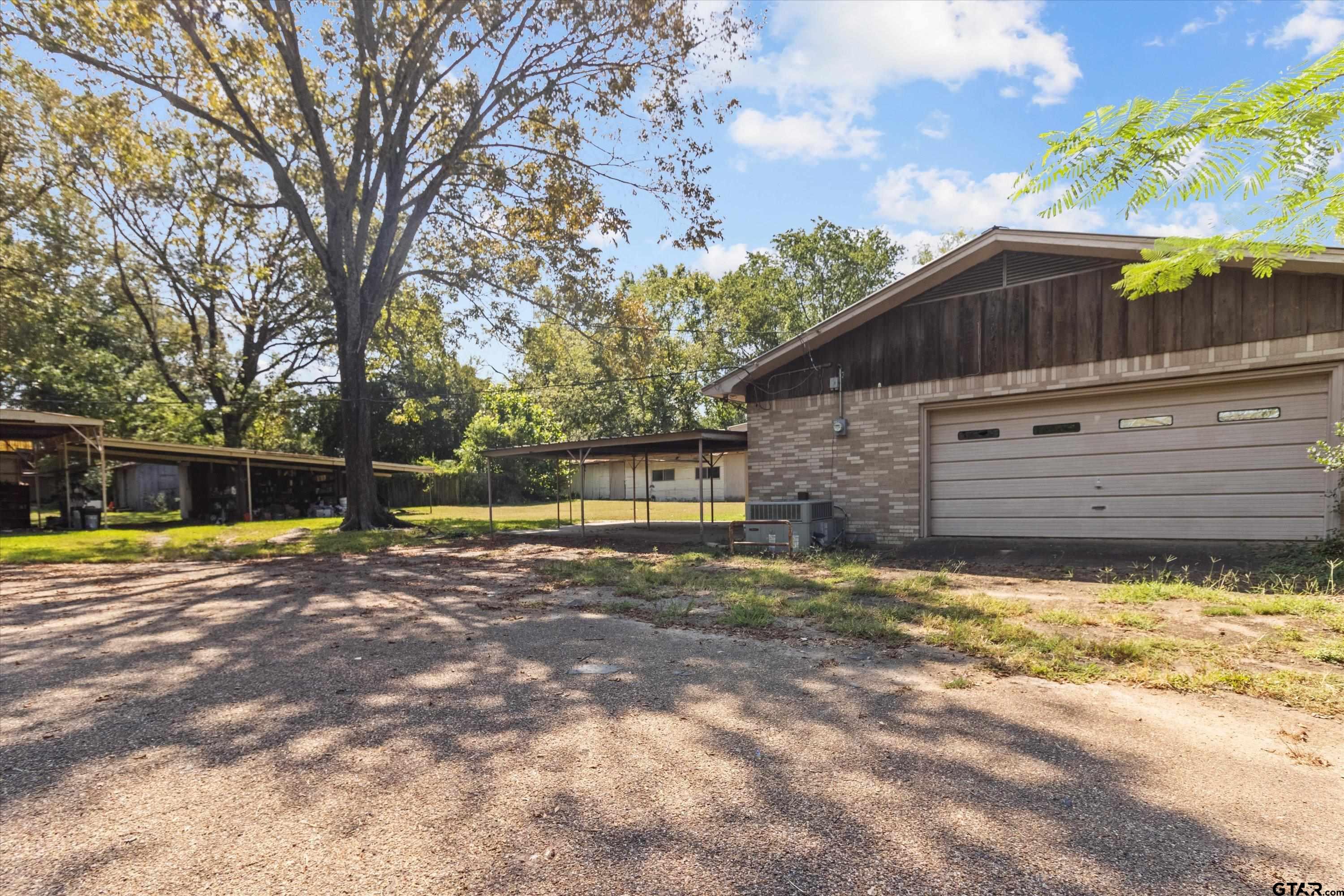 4168 Gallion Avenue Tyler, TX 75708 - Photo 23 of 27 a view of a back yard of the house