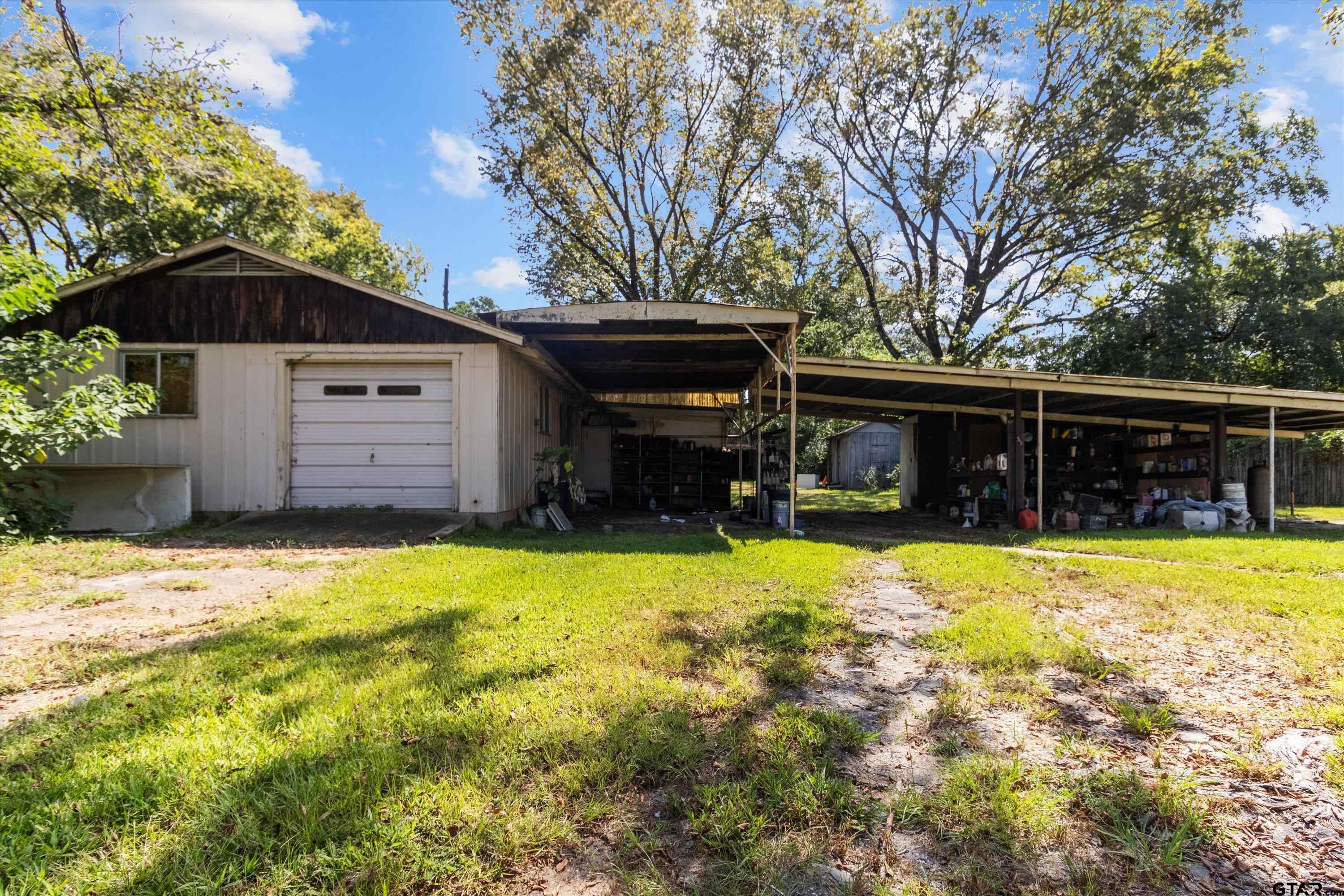 4168 Gallion Avenue Tyler, TX 75708 - Photo 25 of 27 a front view of a house with a yard