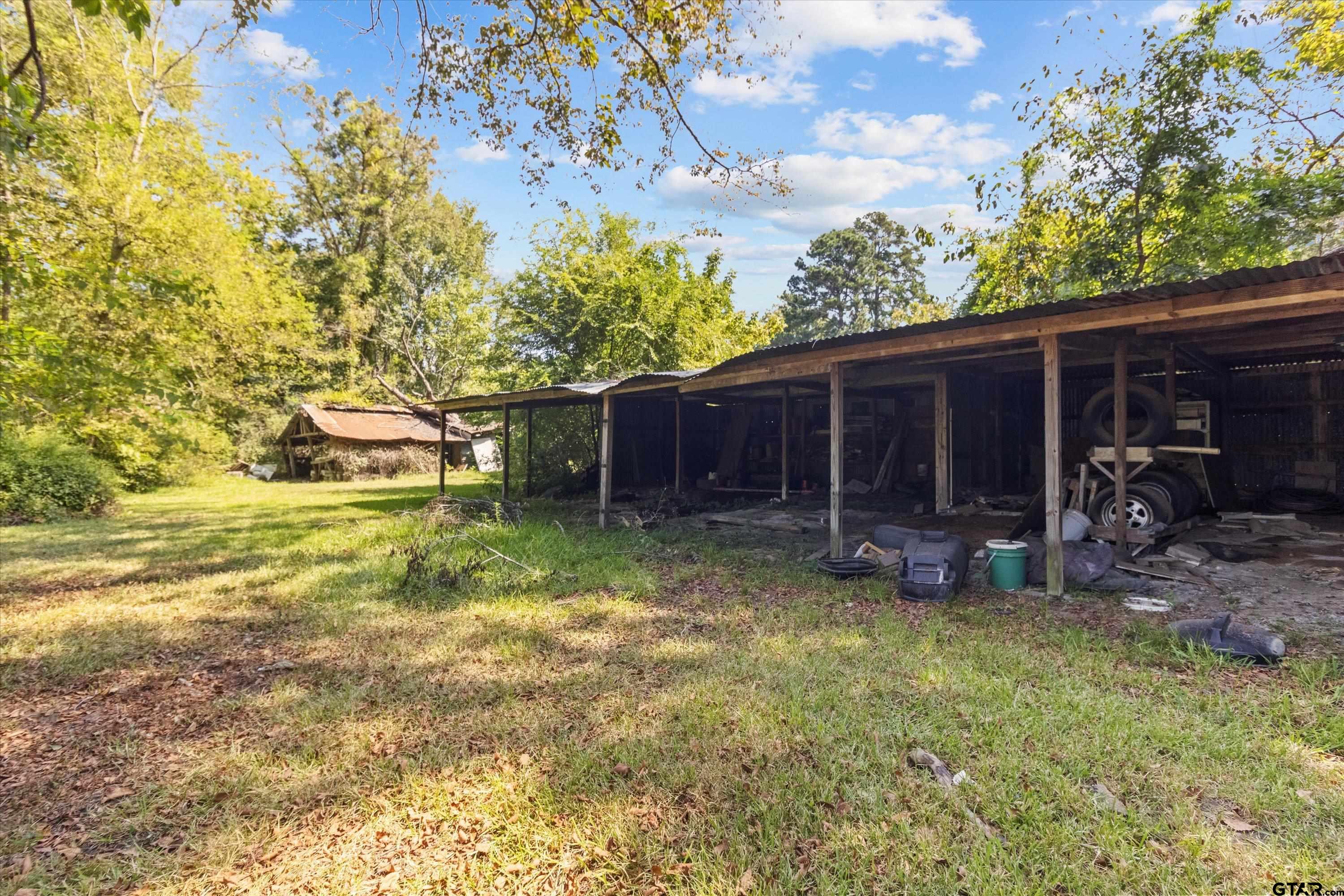 4168 Gallion Avenue Tyler, TX 75708 - Photo 26 of 27 a view of a house with backyard porch and sitting area