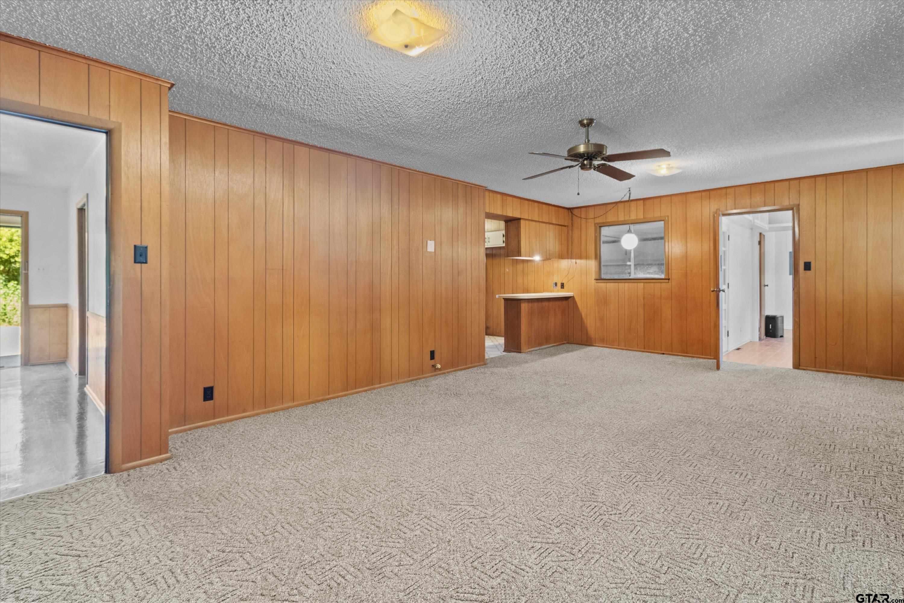 4168 Gallion Avenue Tyler, TX 75708 - Photo 3 of 27 a view of empty room with a ceiling fan and window