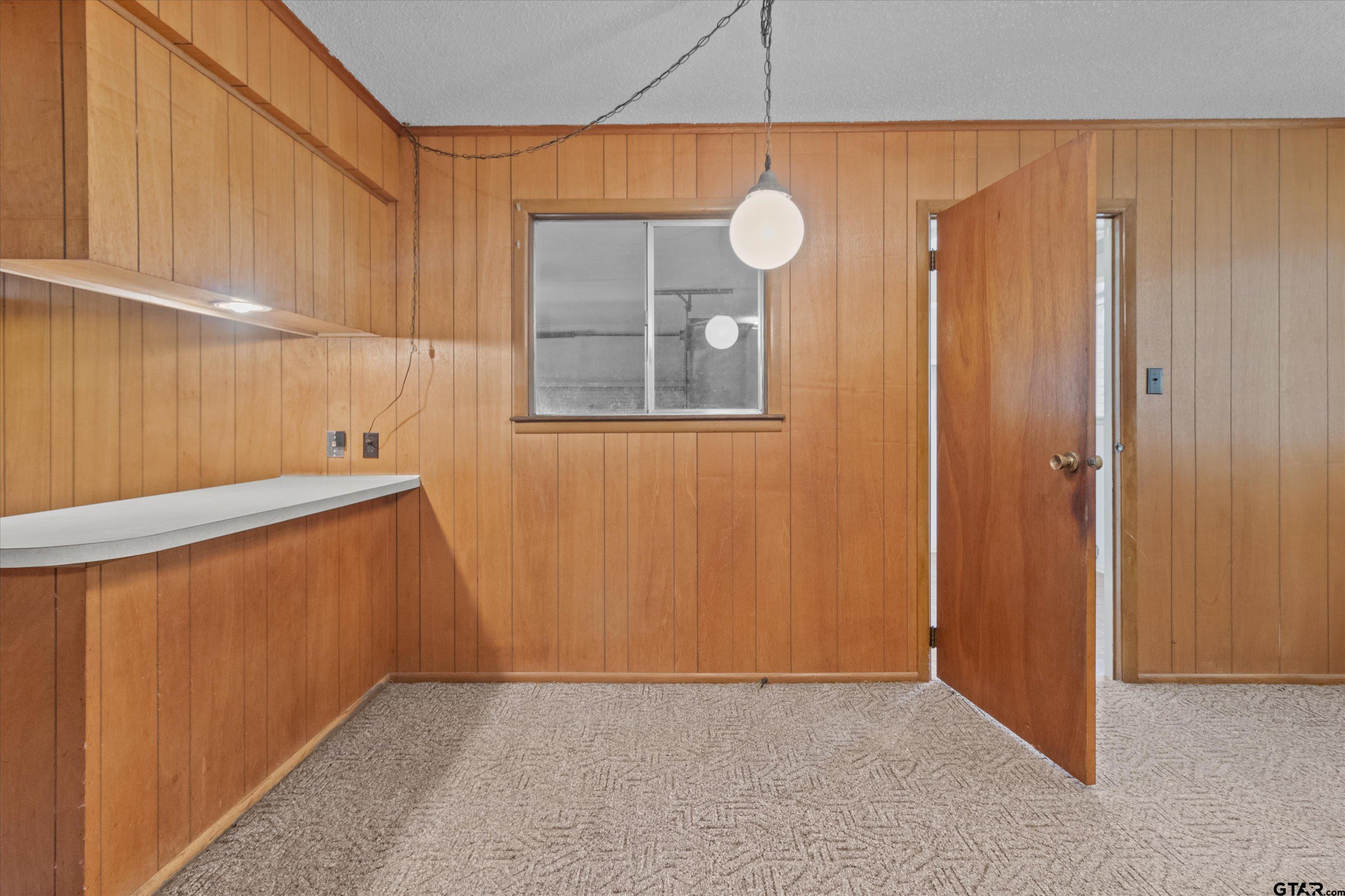 4168 Gallion Avenue Tyler, TX 75708 - Photo 6 of 27 an empty room with closet area and mirrors