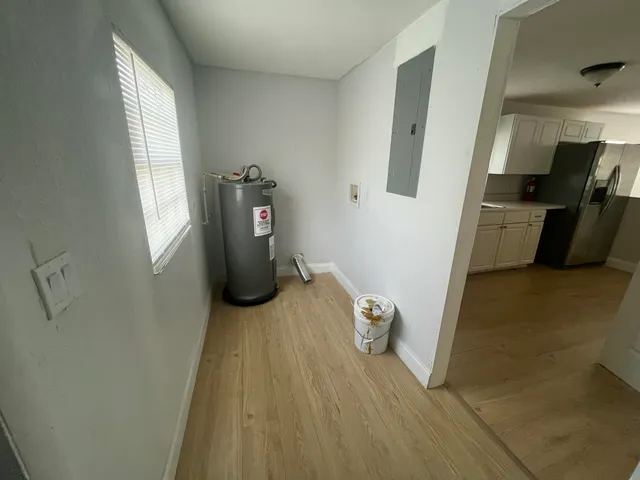 a view of a hardwood floor and staircase