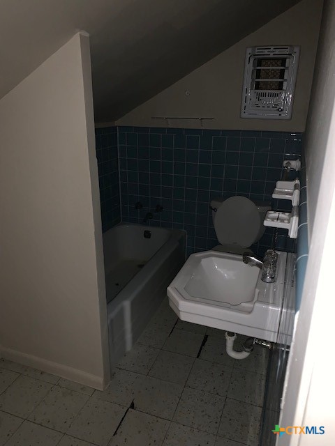 1205 Florence Road Killeen, TX 76541 - Photo 15 of 15 a bathroom with a sink a toilet and a shower