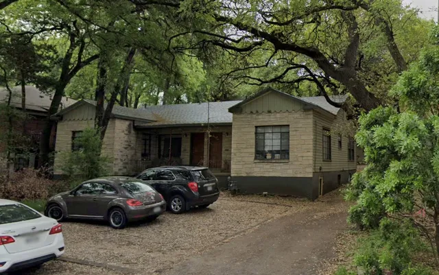 a car parked in front of a house