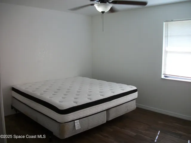 a room with a bed and a window