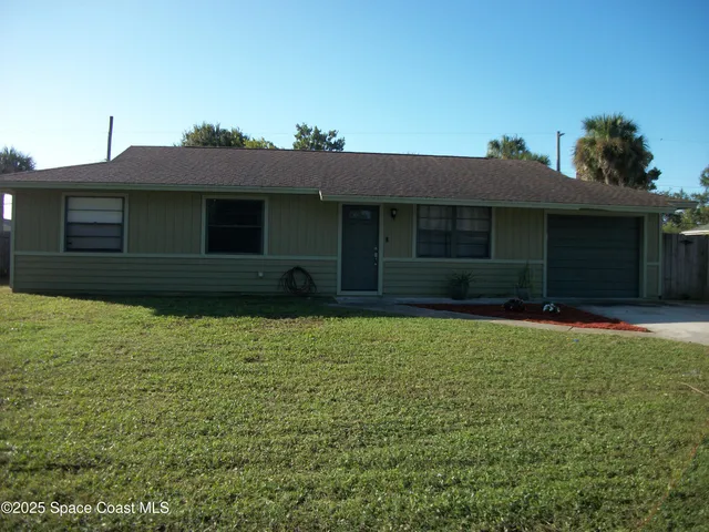 a house view with a garden space