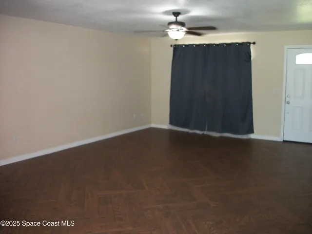 en empty room with wooden floor