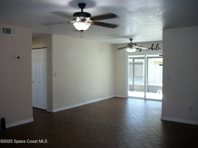 a view of an empty room with a window