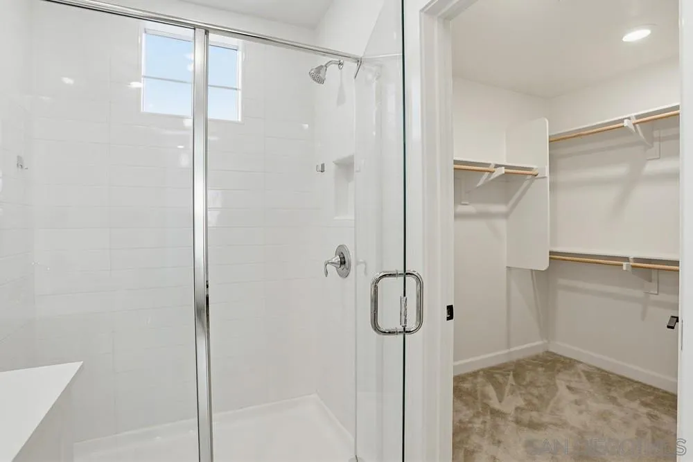 4373 Pacifica Way, Unit 6 Oceanside, CA 92056 - Photo 24 of 48 a bathroom with a glass shower door