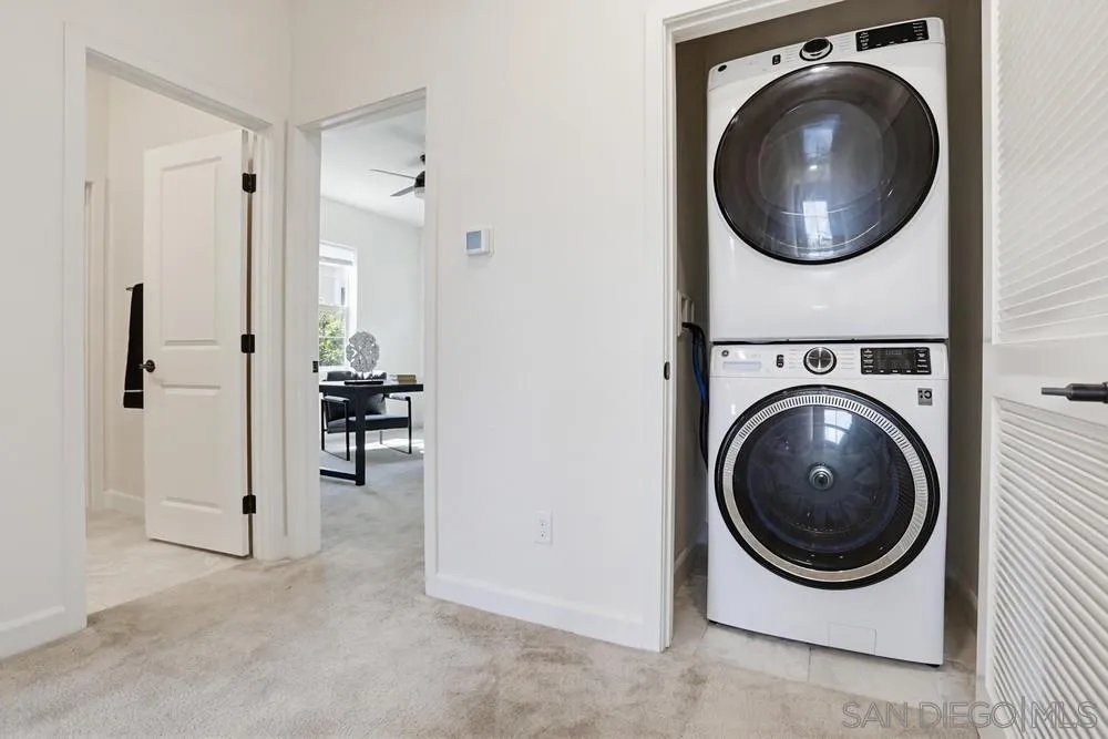 4373 Pacifica Way, Unit 6 Oceanside, CA 92056 - Photo 26 of 48 a view of a hallway with washer and dryer