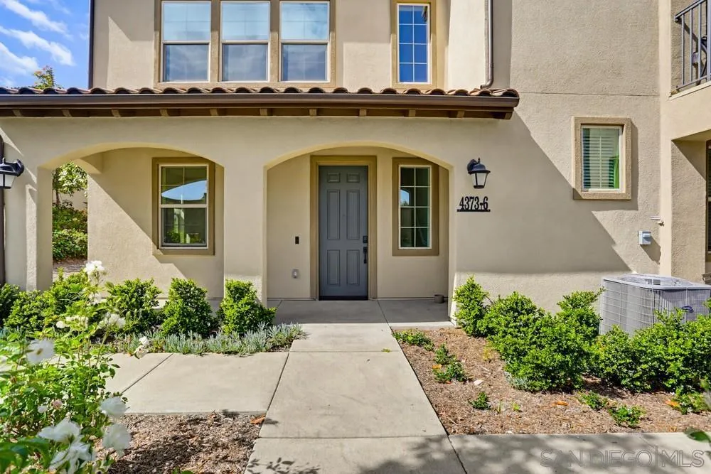 4373 Pacifica Way, Unit 6 Oceanside, CA 92056 - Photo 3 of 48 a front view of house with yard