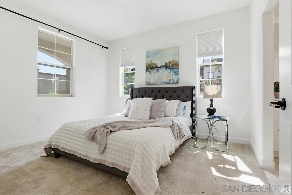 4373 Pacifica Way, Unit 6 Oceanside, CA 92056 - Photo 36 of 48 a bedroom with bed and a window