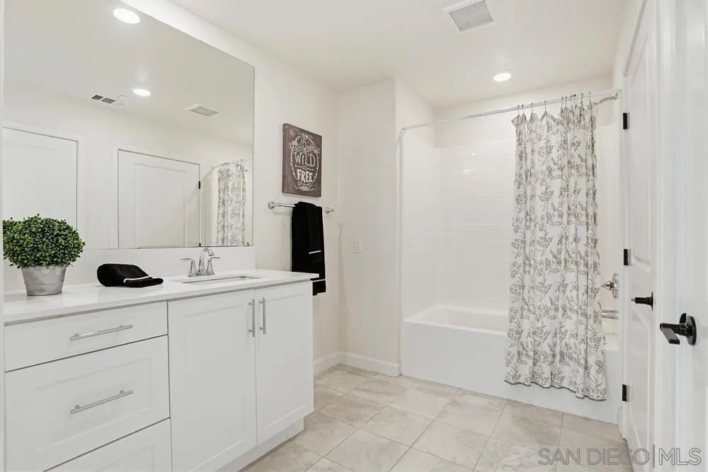 4373 Pacifica Way, Unit 6 Oceanside, CA 92056 - Photo 38 of 48 a bathroom with a sink toilet and shower
