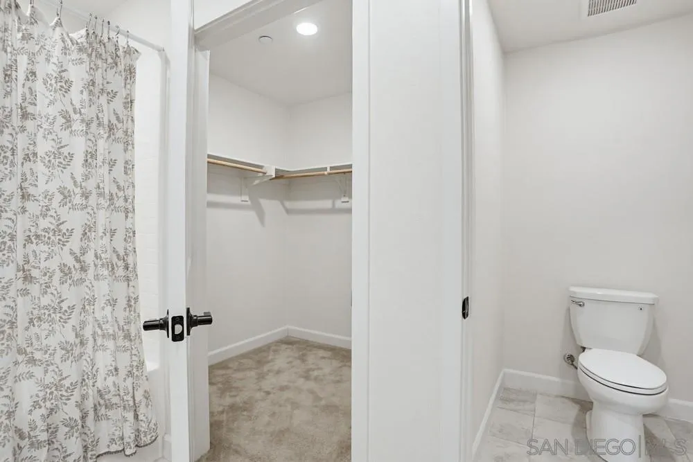 4373 Pacifica Way, Unit 6 Oceanside, CA 92056 - Photo 39 of 48 a bathroom with a toilet and a shower
