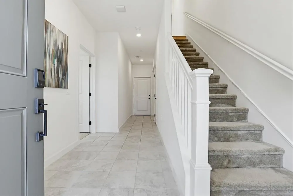 4373 Pacifica Way, Unit 6 Oceanside, CA 92056 - Photo 4 of 48 a view of an entryway with staircase